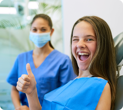 smiling girl in dentist chair